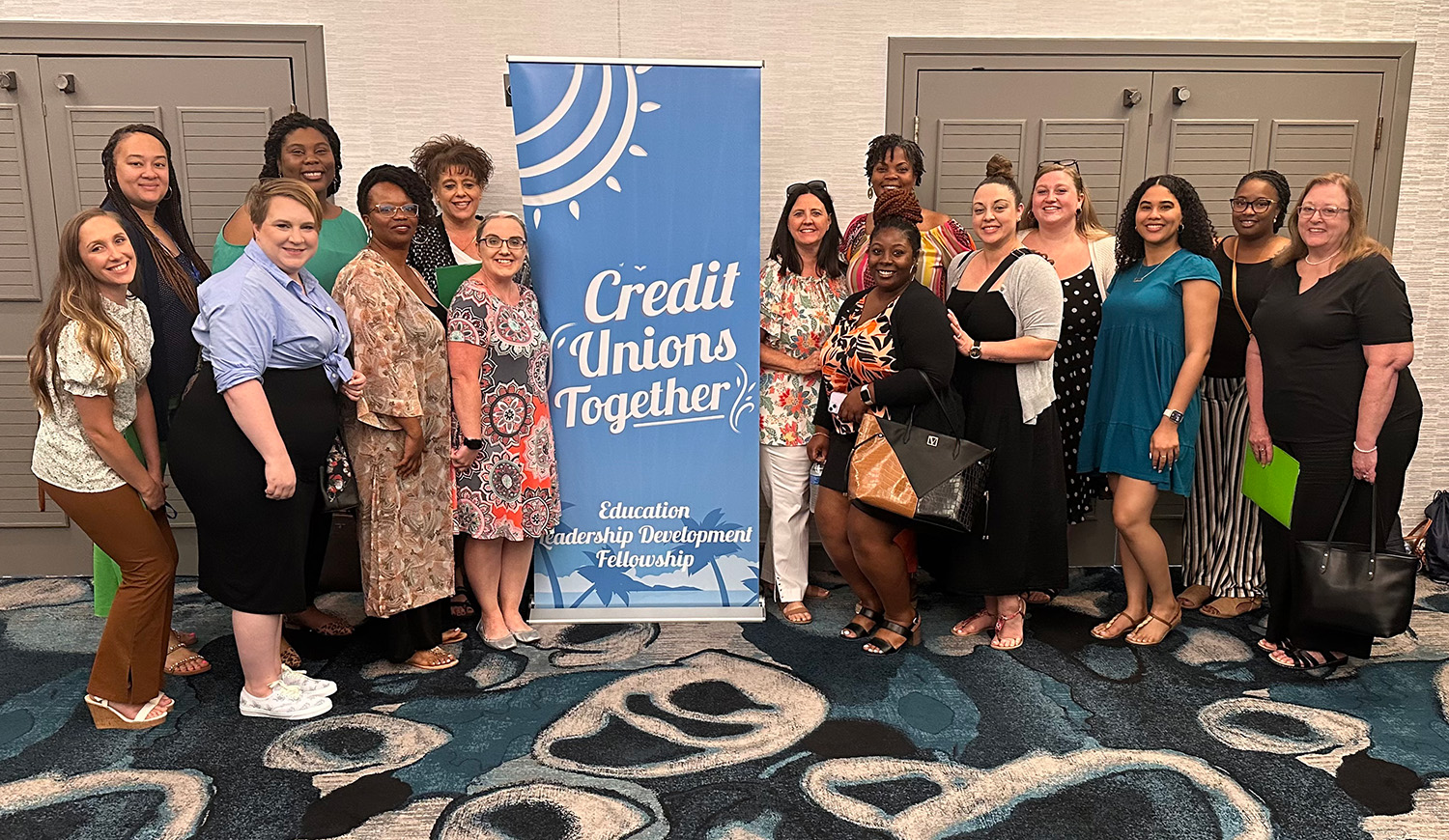 A group of team members in blue Palmetto Citizens shirts wearing medical masks.