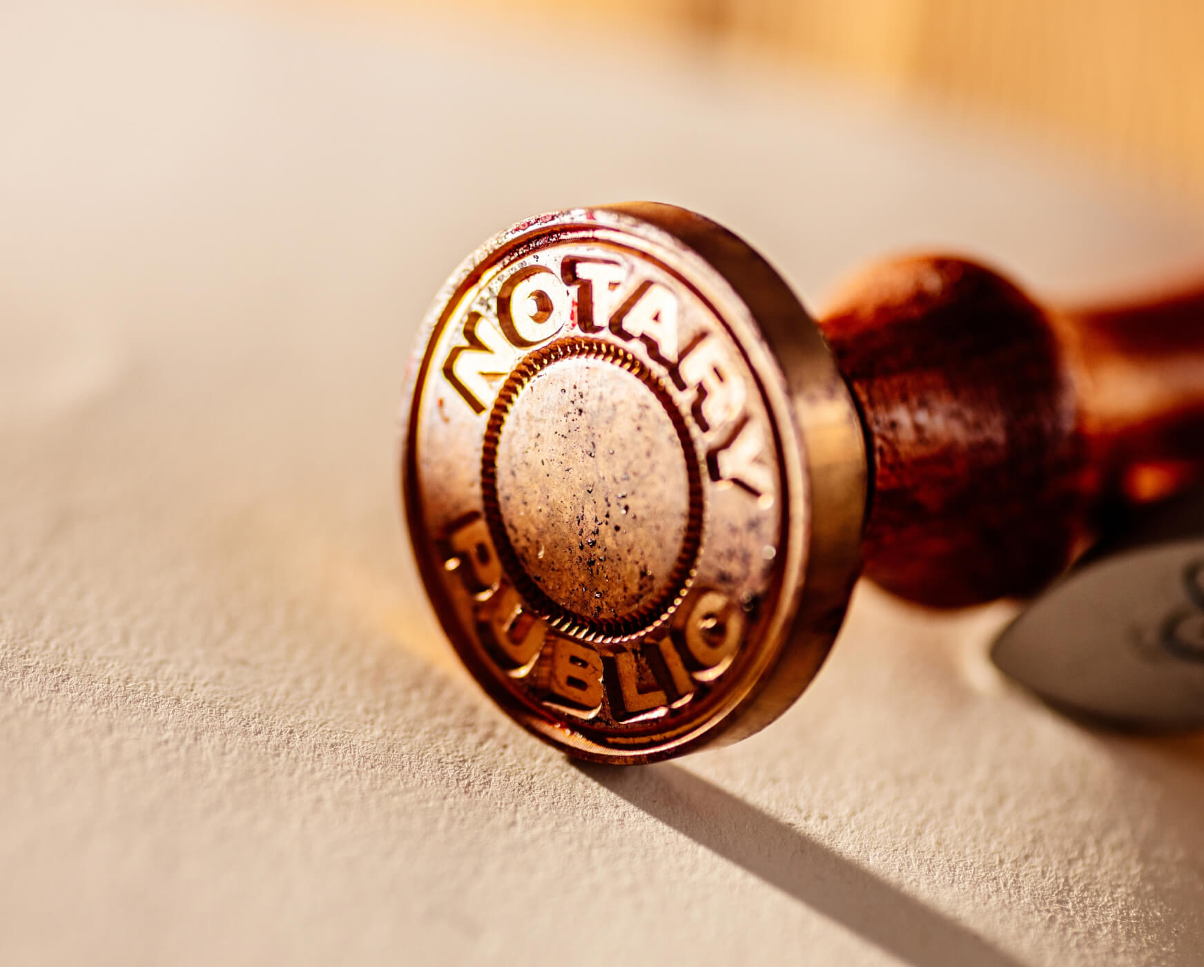Close-up of a notary public embosser seal on paper.