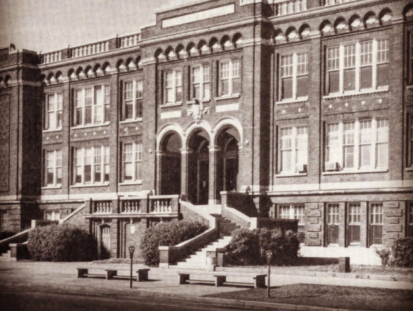 A black and white photo of the Columbia High School as Columbia Teachers FCU building.