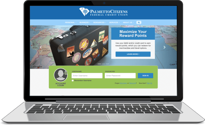 Laptop displaying credit union's rewards program and login page.